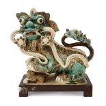 A large Chinese pottery figure of a Buddhist lion, late Ming dynasty, modelled seated, with back