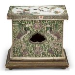 A Chinese biscuit porcelain famille verte stand, Kangxi period, painted to the top surface with a