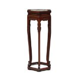 A Chinese rosewood marble inset jardinière stand, early 20th century, the hexagonal top above carved