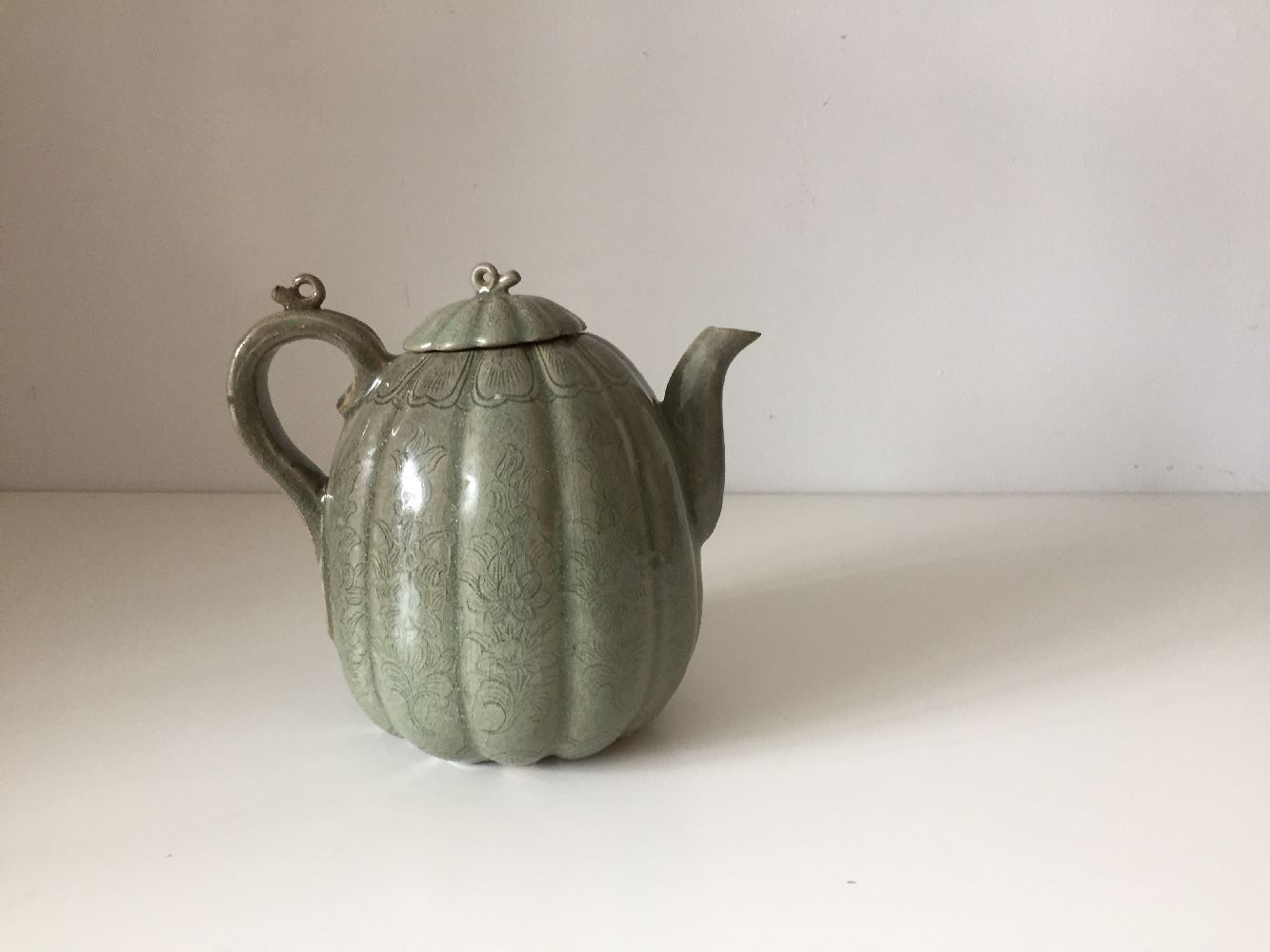 A Korean stoneware celadon melon-shaped teapot, Goryeo dynasty, the lobed body decorated with - Image 3 of 10