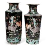 Two similar Chinese porcelain famille noir vases, 18th and 19th century, each painted in famille