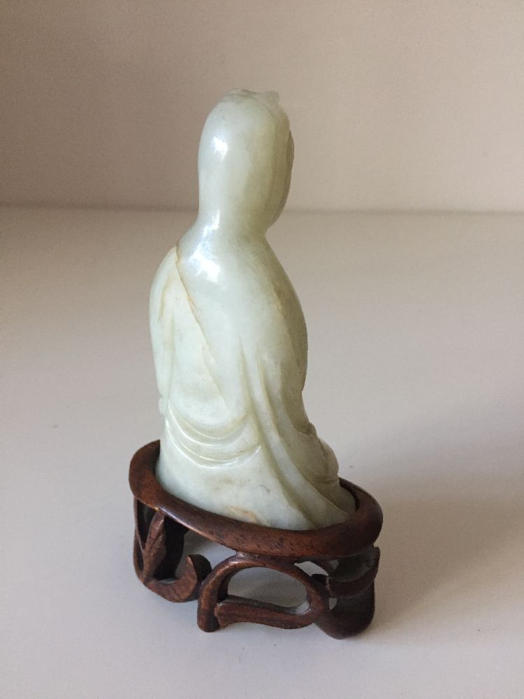 A Chinese pale green jade ‘Guanyin’ carving, 19th century, carved seated with her long robes wrapped - Image 5 of 9