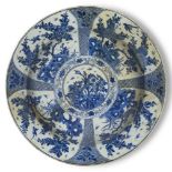 A Chinese porcelain blue and white charger, Kangxi period, painted with flowering peony blossoms