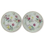 A pair of Chinese export porcelain famille rose plates, 18th century, painted with peony and