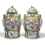 A pair of large Chinese Canton porcelain famille rose vases and covers, mid-19th century,