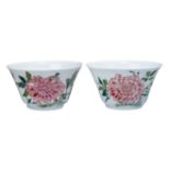 A pair of Chinese porcelain famille rose 'peony' cups, mid-19th century, painted with flowering