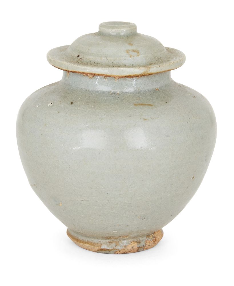 A Chinese pottery jar and cover, 15th century, covered in a greyish-green glaze, 12cm highPlease