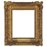 An English Carved and Gilded Régence Style Frame, mid-late 18th century- with cavetto sight, raked