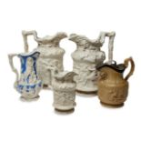 A pair of Victorian stoneware relief moulded jugs, mid-19th century, by Charles Meigh, modelled with