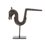 A tempered steel Mughal horse wall bracket, India, 17th century, the finial in the form of a horse's