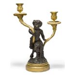A French gilt and patinated bronze twin-light candelabrum, late 19th century, modelled as a satyr