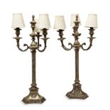 A pair of Victorian brass electroplated three-branch candelabra, c.1860, each with reeded stem