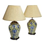 A pair of modern Chinoiserie yellow ground table lamps, modelled as ginger jars and covers,