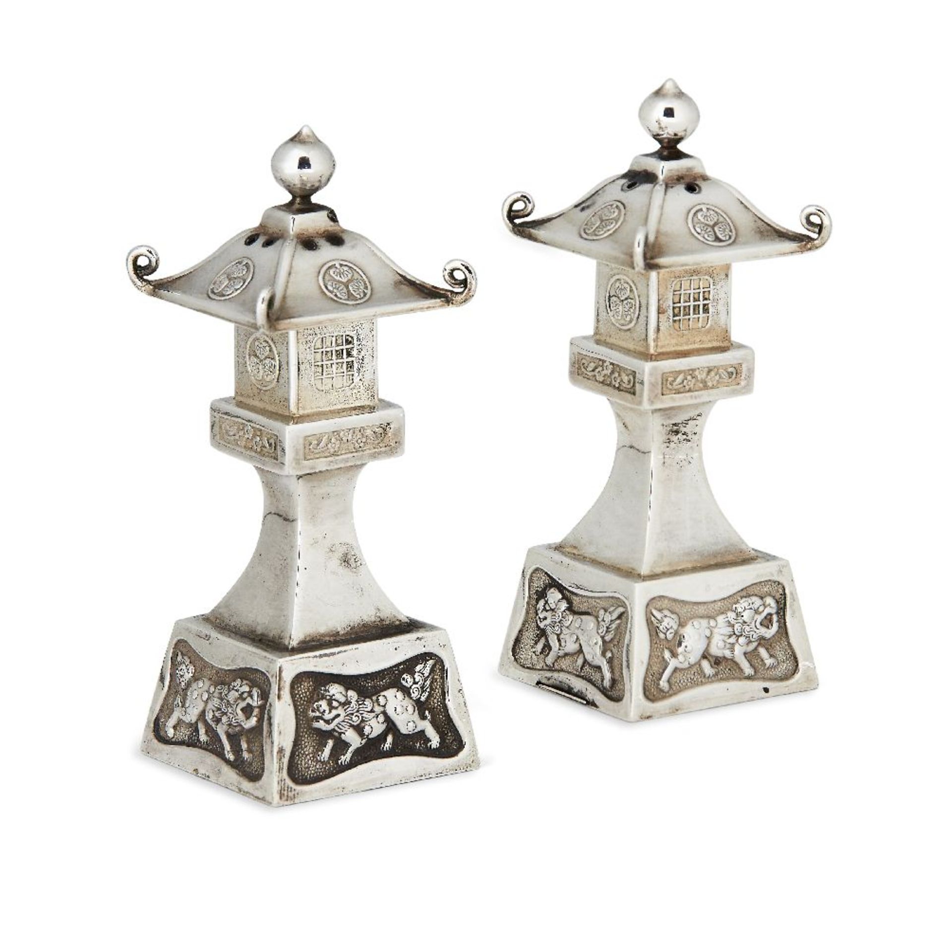 A pair of novelty Japanese silver 'pagoda' salt and pepper shakers, in fitted case, each stamped