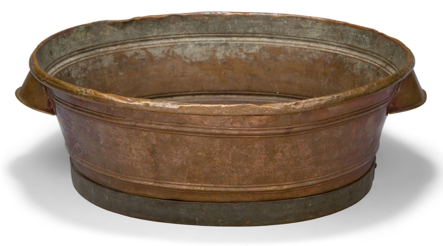 A copper jardiniere, late 19th century, of oval form with twin carrying handles, 50cm wideThe rim