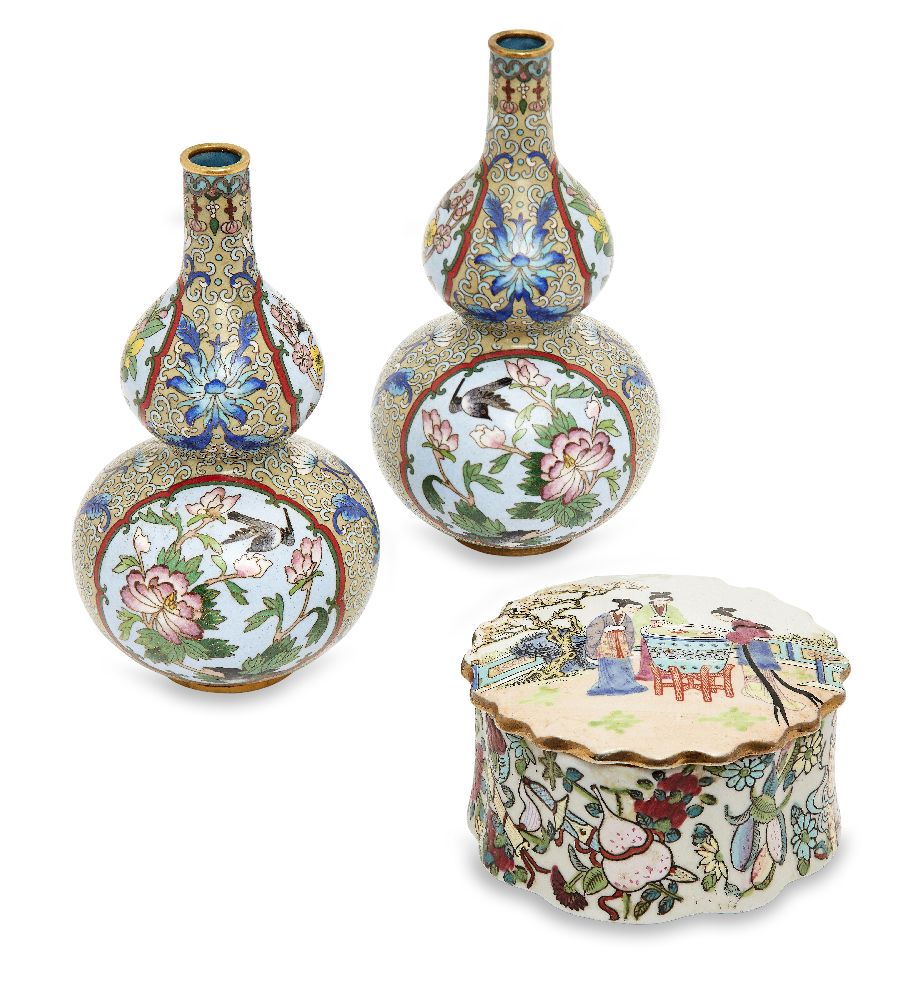 A pair of Chinese cloisonne double-gourd vases, 20th century, decorated with reserves of flowers and