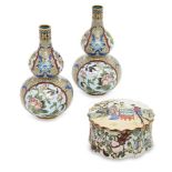 A pair of Chinese cloisonne double-gourd vases, 20th century, decorated with reserves of flowers and