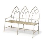 A Gothic style cast-iron bench, early 20th century, with three pointed arch panels to the back,