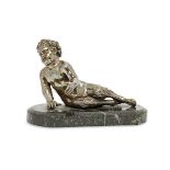 A French bronze model of a reclining satyr, late 19th century, on an associated green marble base,