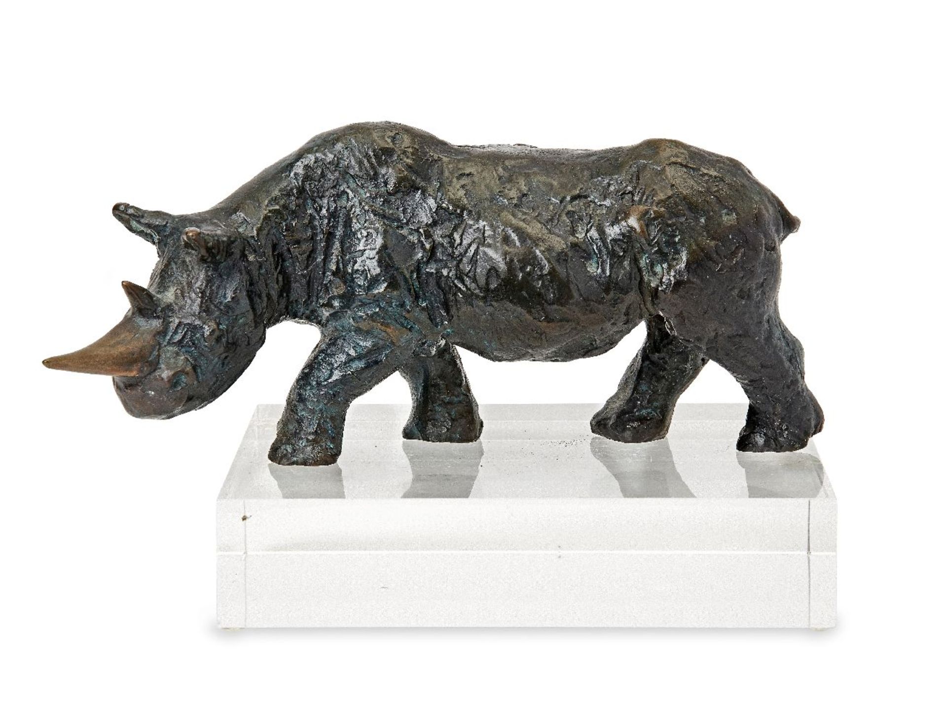 A modern bronze model of a rhino, artist's monogram TT, 2012, on a perspex plinth, 24cm wideGood,