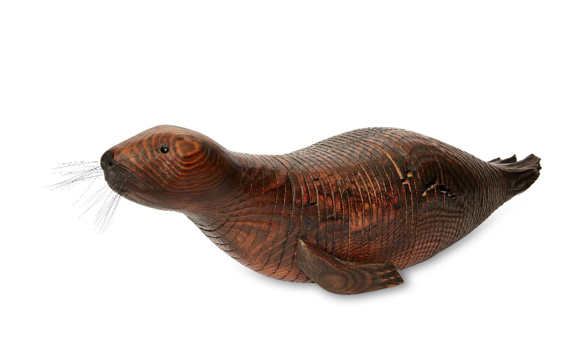 Jeff Soan, an articulated wood model of a seal, 1998, inset eyes and whiskers, signed to the back of