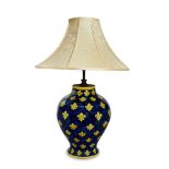A large modern Italian glazed pottery table lamp, of baluster form decorated with fleur-de-lys, 41cm
