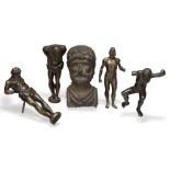 A group of four bronze models of classical male figures, 19th century; together with a bronze relief