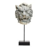 A French repousse zinc lion mask, 19th century, on modern stand, 43cm high overallTraces of old