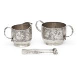 A late 19th century Tiffany & Co. cream jug, sugar and tongs, c.1890, each stamped sterling, the