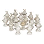 A set of sixteen novelty egg cups, each silver plated egg cup designed with hinged lid topped with