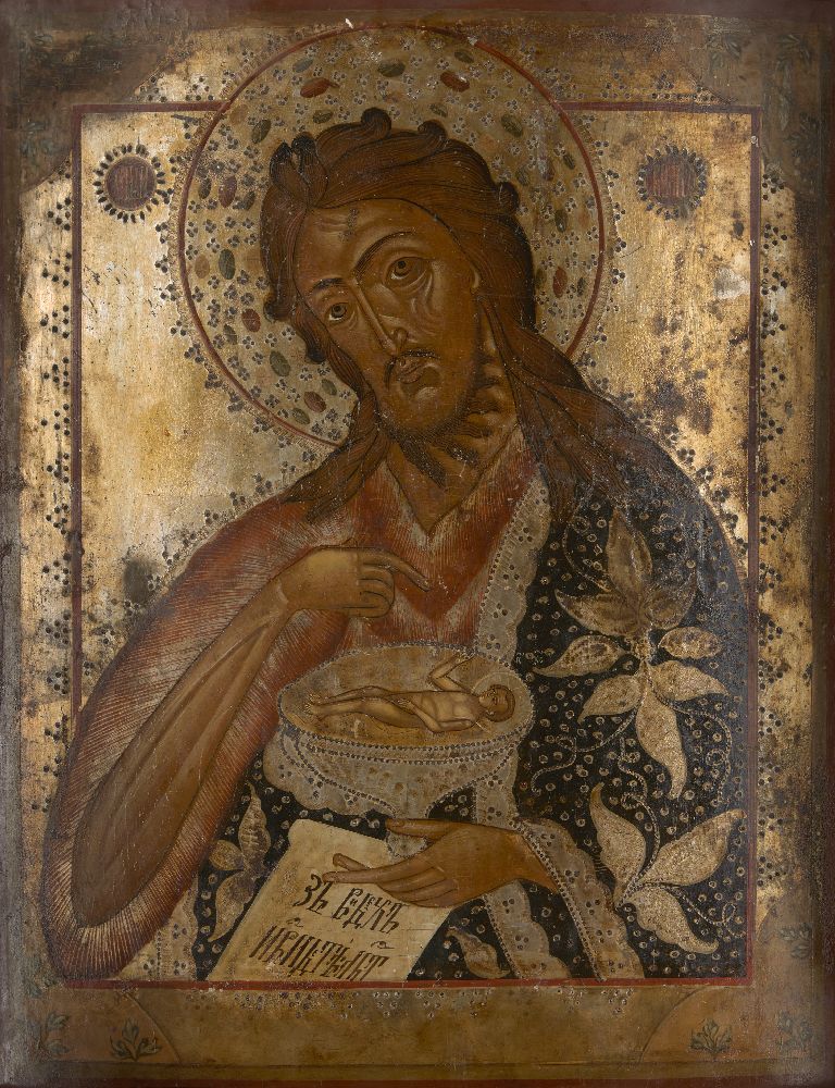 A Russian icon, 19th Century, depicting St. John the Baptist half length, directing with his right