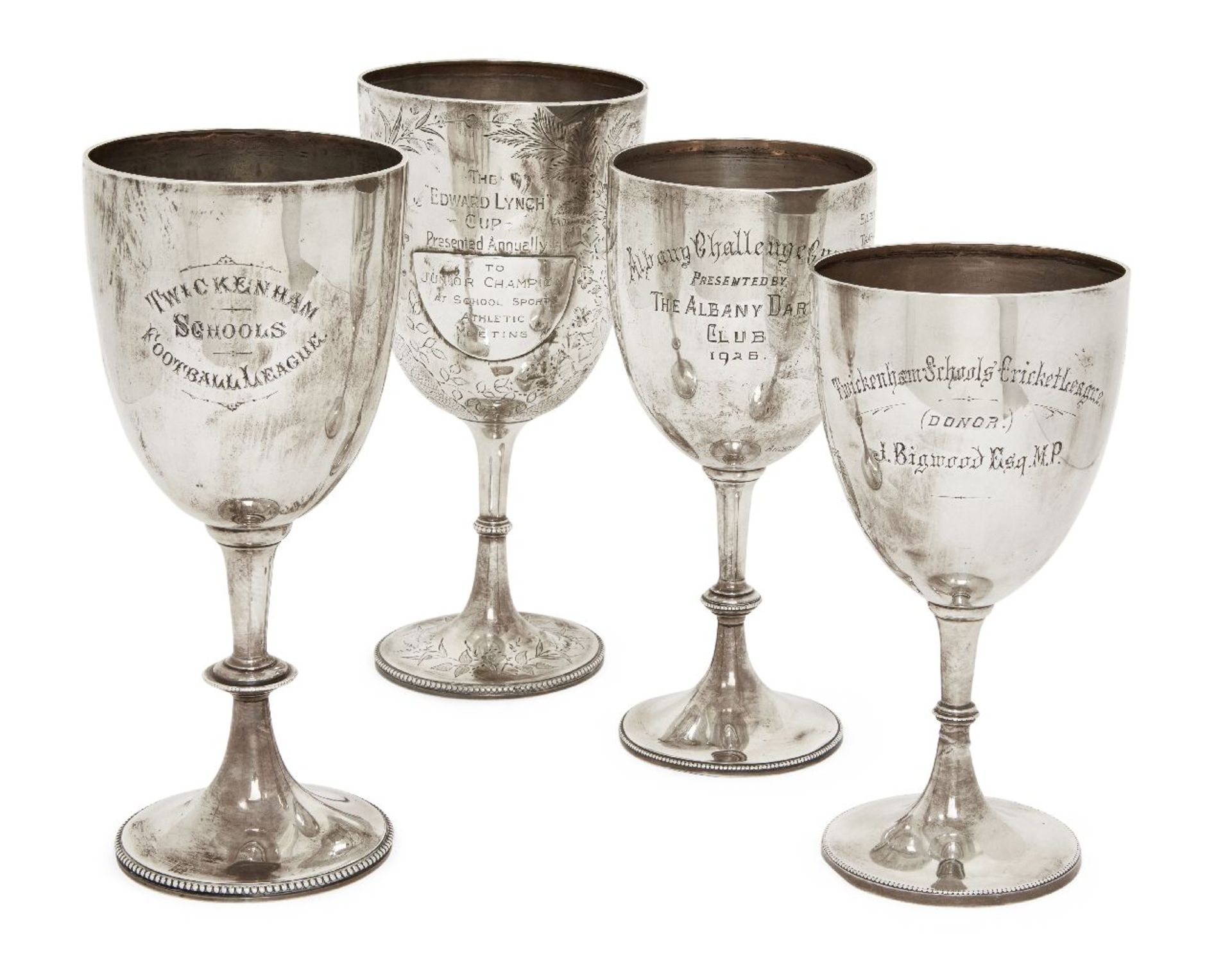 A group of four silver trophy cups, various marks including London, c.1890, and Birmingham, c.