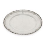 A French silver plate, of shaped circular form with stylised acanthus and ribbon twist rim, the edge