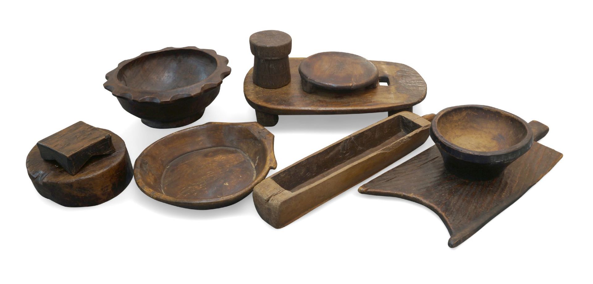 A quantity of African tribal food preparation utensils, 20th century, to include large chopping