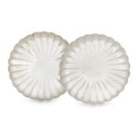 A pair of scalloped plates, stamped sterling 950, of circular form with lobed, sloping sides to