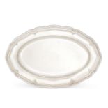 A shaped oval serving plate, stamped Jezler 800, designed with reeded rim and shallow step to flat