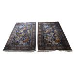 A pair of silk rugs, probably Kashmir, mid to late 20th century, the Indigo field with design of