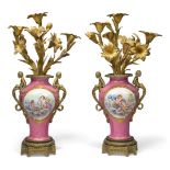 A pair of French gilt-bronze mounted Paris porcelain three-light candelabra, late 19th century,