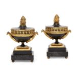 A pair of Empire ormolu and patinated bronze brule-perfums, early 19th century, each of urn form