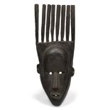 A Bambara / Bamana N'tomo male dancer mask, Mali, 20th century, the carved oval face with stylised