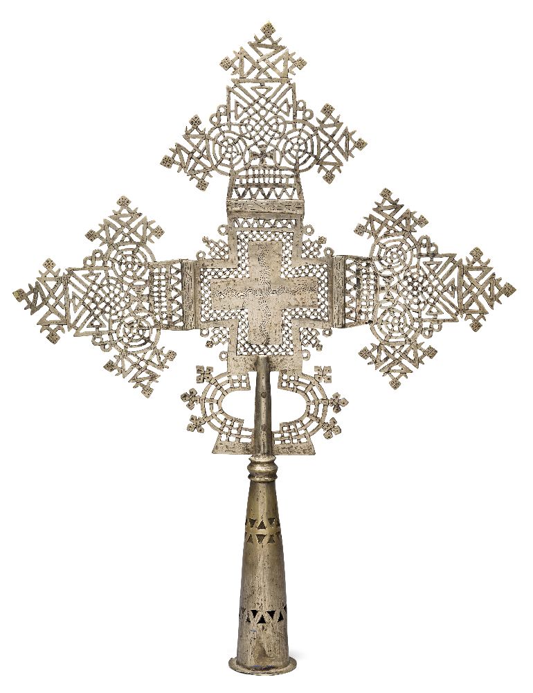 A large Ethiopian Coptic silvered bronze processional cross, probably 19th century, with typical