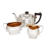 A three piece silver tea set, Birmingham, c.1927, Joseph Gloster, of shaped rectangular form with