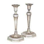 A pair of silver candlesticks, Birmingham, c.1921, Ellis & Co., designed in the Adam style, the