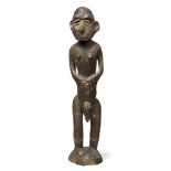 A Sepik river region carved figure, New Guinea, 20th century, of stylised figural form, with painted