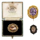 Three brooches, comprising: a gold and amethyst brooch, c.1830, centring on a cut-cornered