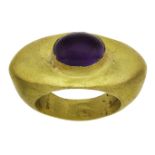 An amethyst ring, in the Roman style, centring on an oval cabochon amethyst, unmarked, ring size O