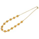 A bead necklace with chain link back chain, Egyptian marks, to a gilt clasp, length 52cm,