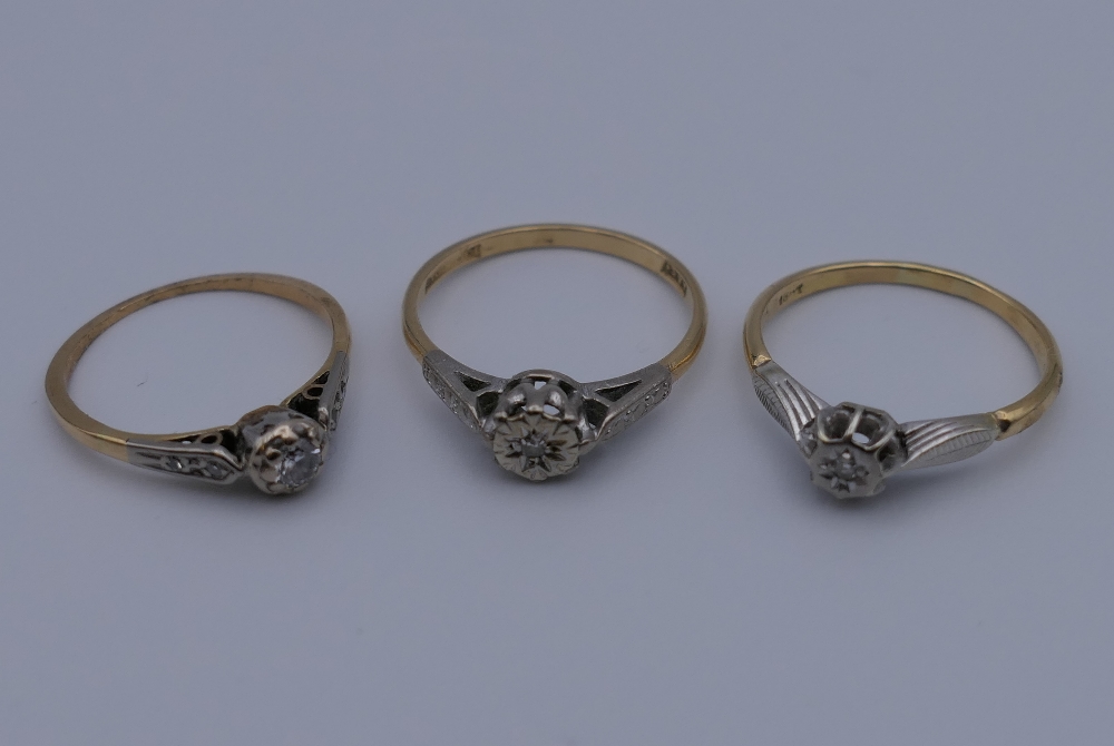 Three 18 ct gold and platinum diamond rings. 7.2 grammes total weight.