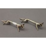 A pair of silver plated fox form knife rests. 10.5 cm long.