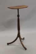 An early 19th century mahogany adjustable reading stand. 41 cm wide.